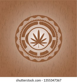 weed leaf icon inside wooden emblem
