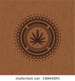 weed leaf icon inside wooden emblem. Retro