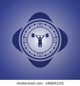 weightlifter girl icon inside badge with denim background