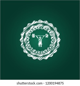 weightlifter girl icon inside chalkboard emblem written on a blackboard