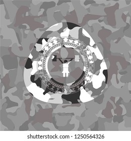 weightlifter girl icon inside grey camouflaged emblem