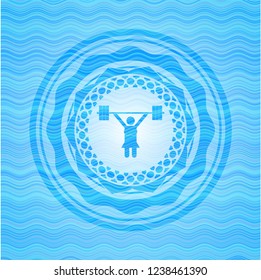 weightlifter girl icon inside light blue water wave badge.
