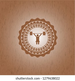 weightlifter girl icon inside realistic wooden emblem