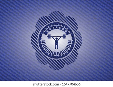 weightlifting icon inside badge with denim background