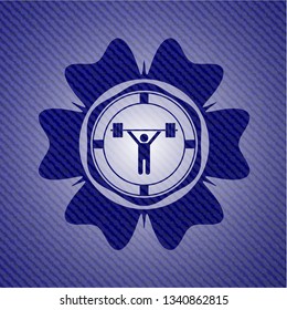 weightlifting icon inside badge with jean texture