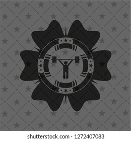 weightlifting icon inside black emblem
