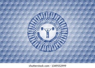 weightlifting icon inside blue emblem with geometric background.