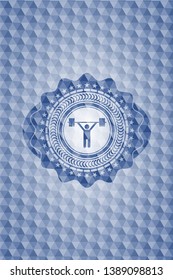 weightlifting icon inside blue emblem with geometric pattern background.