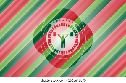 weightlifting icon inside christmas colors badge.