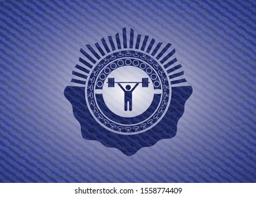 weightlifting icon inside emblem with denim texture