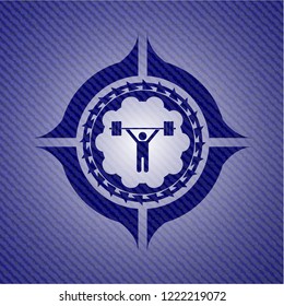weightlifting icon inside emblem with jean texture
