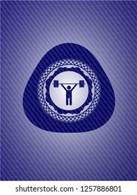 weightlifting icon inside emblem with jean background
