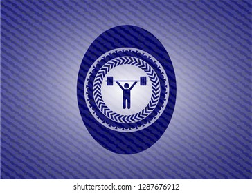 weightlifting icon inside emblem with jean background