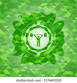 weightlifting icon inside green emblem. Mosaic background