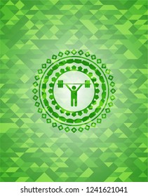 weightlifting icon inside green emblem with mosaic background