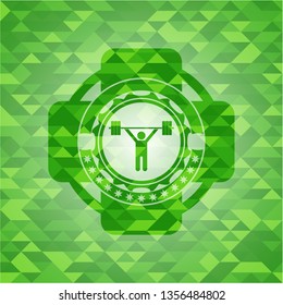 weightlifting icon inside green emblem with mosaic ecological style background