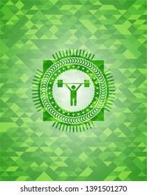 weightlifting icon inside green emblem with mosaic background