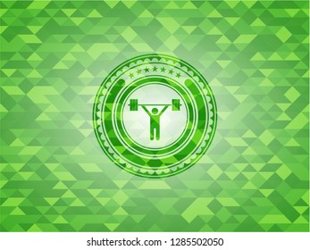 weightlifting icon inside green mosaic emblem