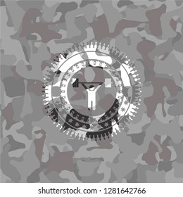 weightlifting icon inside grey camouflage texture