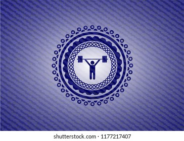 weightlifting icon inside jean or denim emblem or badge background
