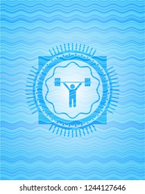 weightlifting icon inside light blue water wave style badge.