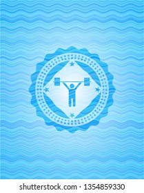 weightlifting icon inside light blue water emblem background.