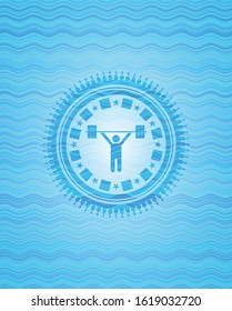 weightlifting icon inside light blue water badge background.