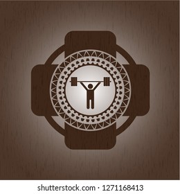 weightlifting icon inside realistic wooden emblem