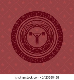 weightlifting icon inside red emblem