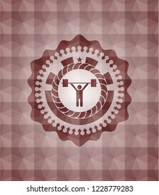weightlifting icon inside red seamless emblem with geometric pattern background.