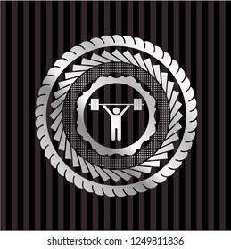 weightlifting icon inside silvery badge or emblem