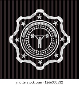 weightlifting icon inside silvery badge or emblem
