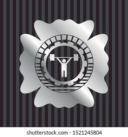 weightlifting icon inside silvery emblem or badge