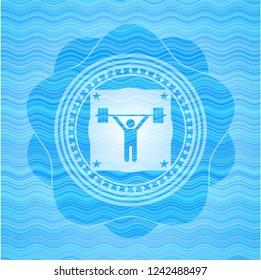 weightlifting icon inside sky blue water badge background.