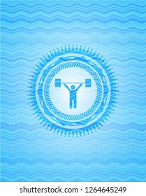 weightlifting icon inside sky blue water wave style emblem.