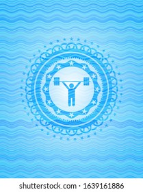 weightlifting icon inside sky blue water wave style badge.