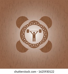 weightlifting icon inside vintage wooden emblem