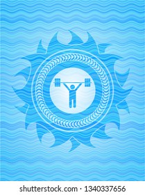 weightlifting icon inside water emblem.