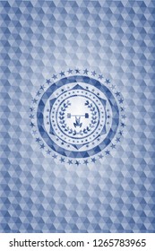 weightlifting inside of crown icon inside blue polygonal emblem.