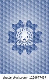 weightlifting inside of crown icon inside blue emblem with geometric pattern.