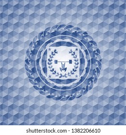 weightlifting inside of crown icon inside blue emblem or badge with geometric pattern background.