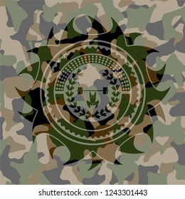 weightlifting inside of crown icon inside camouflage emblem