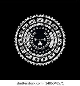 weightlifting inside of crown icon inside chalk emblem written on a blackboard