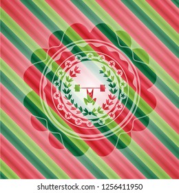 weightlifting inside of crown icon inside christmas style emblem.