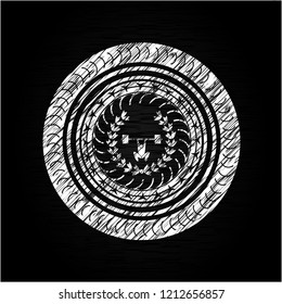 weightlifting inside of crown icon drawn on a blackboard