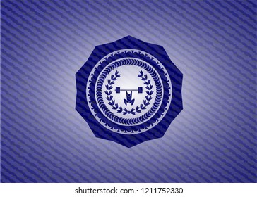 weightlifting inside of crown icon inside emblem with jean background