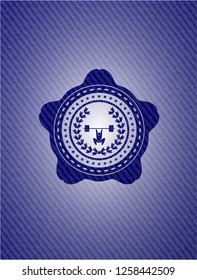 weightlifting inside of crown icon inside emblem with jean background