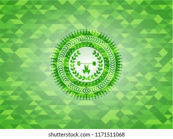 weightlifting inside of crown icon inside green emblem with mosaic background