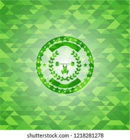 weightlifting inside of crown icon inside green emblem with mosaic background