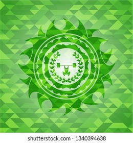 weightlifting inside of crown icon inside green emblem with mosaic ecological style background